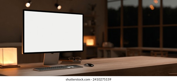 A white-screen PC computer mockup on a hardwood table in a cosy, modern room at night. dark workspace concept. 3d render, 3d illustration
