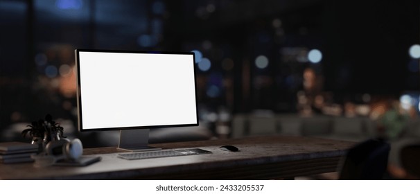 A white-screen PC computer mockup on a desk in a contemporary dark office at night. close-up image. 3d render, 3d illustration