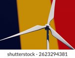 Wind turbine on a background of blurred flag of Chad. Wind power concept, selective focus