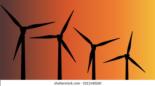 Wind turbines in silhouette against a darkening sky