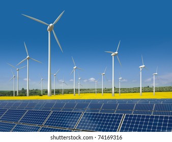 Wind turbines and solar panels in a rapeseed field