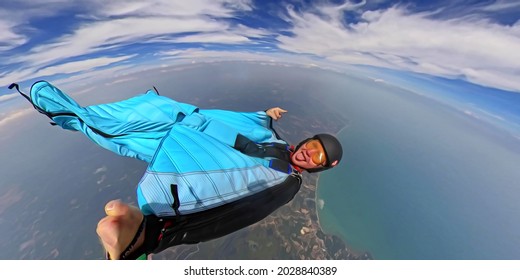 Wing Suit. Flying Man Above Sea