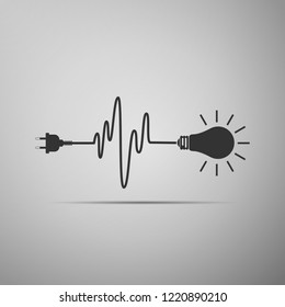 Wire plug and light bulb icon isolated on grey background. Plug, lamp and cord in the form of heartbeat. Concept of Electricity and lighting. Flat design