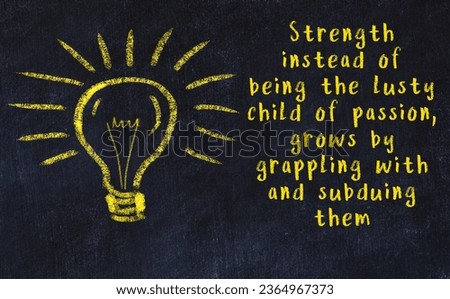 Wise quotation and a chalk drawing of a bulb on black chalkboard