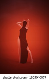 Woman In A Black Shrink Wrap Suit Standing Red Orange Background 3d Illustration