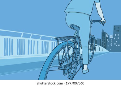 a woman cycling on a bridge into the city