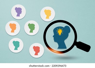 Woman Icon Paper Cut With Lightbulb Inside Magnifying Glass ,choose Different Woman  For Leadership, Outstanding, Smart Vision, People Rights, International Women's Day Concept