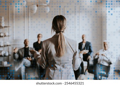 Woman leaser in presentation to a group in a modern office setting. The presenter stands confidently, engaging the audience in a professional environment. Business teamwork, collaboration concept. - Powered by Shutterstock