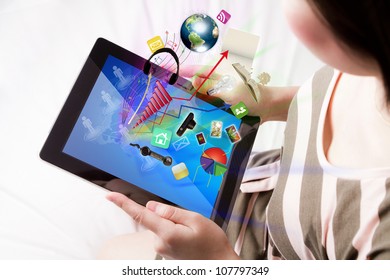 Woman reading the touch screen device (Elements of this image furnished by NASA) - Powered by Shutterstock