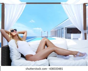 Woman Relaxing In A Cabana At The Pool. 3d Rendering