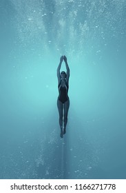 Woman swimming underwater in a sea. This is a 3d render illustration