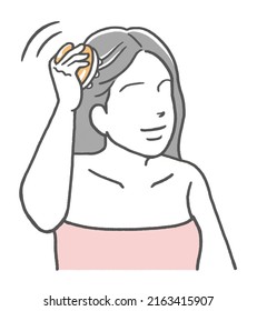 Woman Using A Scalp Massage Brush For Scalp Care