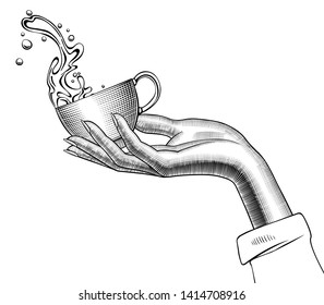 Woman's hand holding Coffee