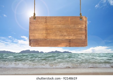 Wood Sign Hanging On Beach