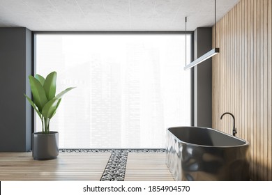 Wooden Bathroom With Black Bathtub, Side View, A Plant And Large Big Window. Grey Wooden Bathroom In Modern Luxury Bath With City View, 3D Rendering, No People