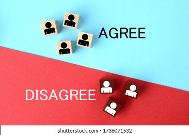 Wooden Blocks With Person Pictogram On Red And Light Blue Background With Agree And Disagree Words