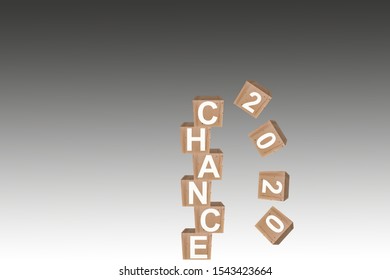 Wooden cube in 3d render with word Chance 2020 in the fall