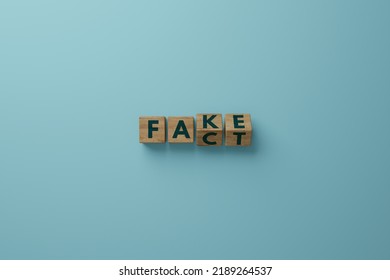 Wooden Cubes With The Word FACT And A Change To FAKE. Concept Of Wrong Information, False Fakes. 3d Render