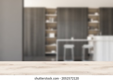 Wooden desk on background of dark kitchen set with table and dishes, bookshelf and rack with books. Mockup for display of product. Modern cooking room and library, 3D rendering - Shutterstock ID 2052572120