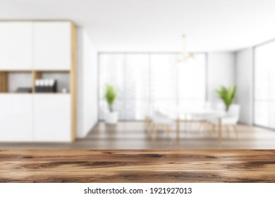 Wooden Desk On Blurred Background Of White And Wooden Room With Chairs On Parquet Floor. Waiting Room Zone, Modern Minimalist Furniture And Window, 3D Rendering No People