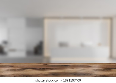 Wooden Desk On Foreground, Background Of Blurred White Reception Room With Two Computers, Conference Office Room. Marble Floor 3D Rendering, No People