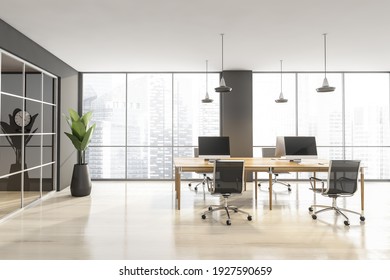 Wooden Grey Room With Armchairs And Tables With Computers. Minimalist Furniture In Open Space Room Behind Glass Doors In Business Interior, 3D Rendering No People