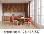 Wooden home kitchen interior with eating table and red chairs, hardwood floor. Minimalist cooking cabinet with kitchenware. Panoramic window on Singapore skyscrapers. 3D rendering