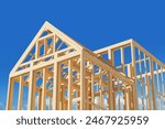 Wooden house frame under construction on a bright blue sky background, concept of home building. 3D Rendering. 