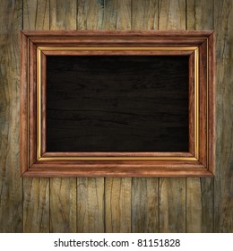 Wooden Picture Frame On The Old Wooden Wall.