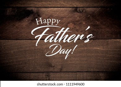 A wooden plank background with a father's day greeting - Powered by Shutterstock