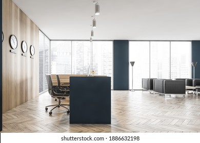 Wooden Reception Hall With Blue Desk And Black Armchairs For Clients, Clocks On Wooden Wall. Minimalist Reception Desk On Parquet Floor In Business Office Near Window, 3D Rendering No People