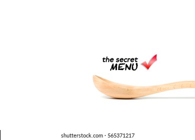 A wooden spoon isolated over white background.With word title the secret menu.