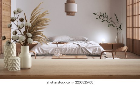 Wooden Table, Desk Or Shelf Close Up With Ceramic Vases With Cotton Flowers Over Japandi Bedroom With Double Bed, Minimalist Japanese Interior Design Concept, 3d Illustration