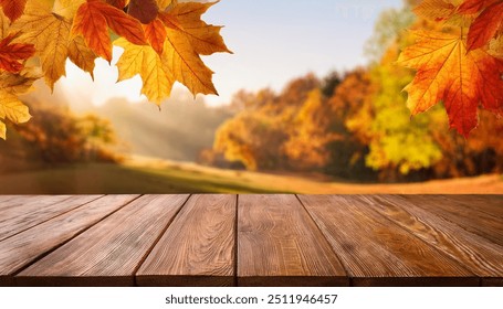 wooden table in front of a colorful autumn landscape, beautiful autumn background concept with fall leaves and advertising space
