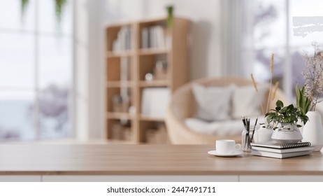 A wooden tabletop adorned with a coffee cup, books, flower vases, and a space for displaying products, set against a blurred background of a cozy Scandinavian living room. 3d render, 3d illustration - Powered by Shutterstock