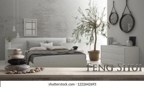 Wooden vintage table shelf with pebble balance and 3d letters making the word feng shui over blurred bedroom with window, chest of drawer, big olive tree, zen concept interior design, 3d illustration