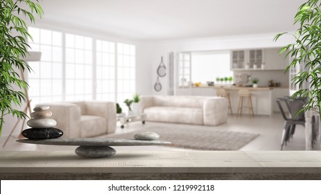 Wooden vintage table or shelf with stone balance, over blurred scandinavian living room and kitchen, feng shui, zen concept architecture interior design, 3d illustration