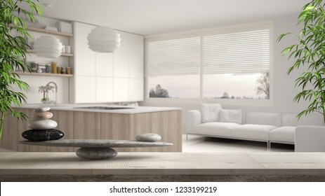 Wooden vintage table or shelf with stone balance, over blurred modern white and wooden kitchen with shelves and cabinets, feng shui, zen concept architecture interior design, 3d illustration