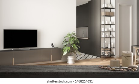 Wooden vintage table top or shelf with candles and pebbles, zen mood, over scandinavian minimalist living room with kitchen, white architecture interior design, 3d illustration - Shutterstock ID 1488214631