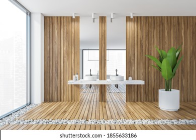 Wooden White Bathroom With Two Sinks And Tall Mirrors In Modern Luxury Flat. Front View Of Two Separate Sinks On Wooden Wall And A Big Plant 3D Rendering, No People