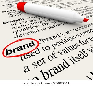 The Word Brand Defined In A Dictionary With Definition Explained To Emphasize Awareness, Branding, Loyalty, Identity And Value