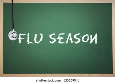 The Word Flu Season And Stethoscope Against Chalkboard