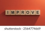 The word IMPROVE is made of wooden cubes.close up of wooden elements,Business Concept.3D rendering on red background.