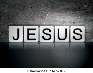 The word "Jesus" written in white tiles against a dark vintage grunge background.