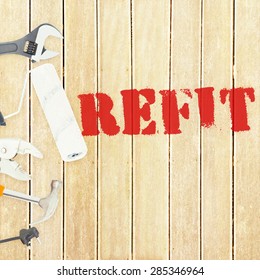 The word refit against tools on wooden background