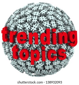 The Words Trending Topics On A Ball Or Sphere Of Hash Tags To Illustrate Hot News, Buzz Or Trends On Social Networks And Reporting Sites