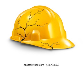 Work accident and health hazards on the job as a broken cracked yellow hardhat helmet as a symbol of working injury and insurance claims from physical damage and pain to the worker.