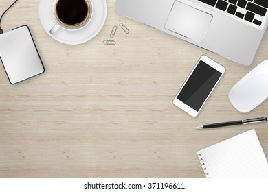 Workplace with tablet computer and mobile phone on table