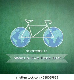 World car free day on September 22 with chalk drawing bicycle and world bike wheels on green chalkboard