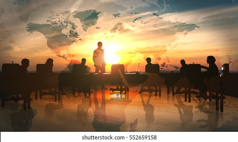 World Management Team in office silhouette 